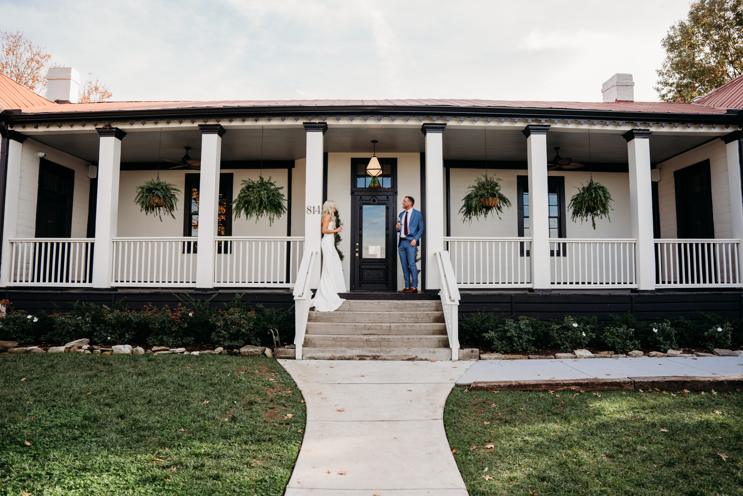 bride-and-groom-standing-on-porch-the-estelle-nashville